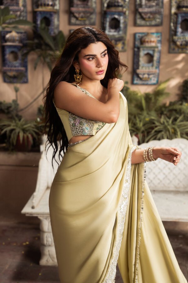 Front view of Marigold luxury silk saree featuring an embroidered bodice with sequins and beadwork.