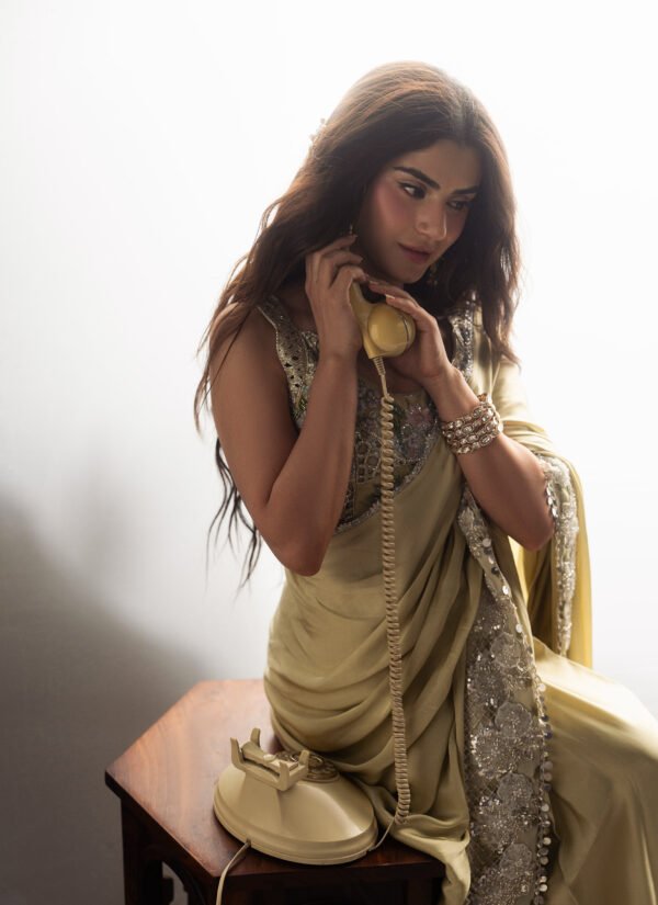 zubab rana wearing Marigold Shamooz silk saree with elegant draping during an editorial fashion shoot.