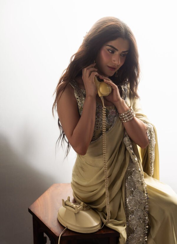 zubab rana wearing Marigold Shamooz silk saree with elegant draping during an editorial fashion shoot.