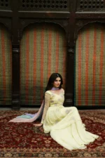 Seated look of Sunehri luxury peplum dress