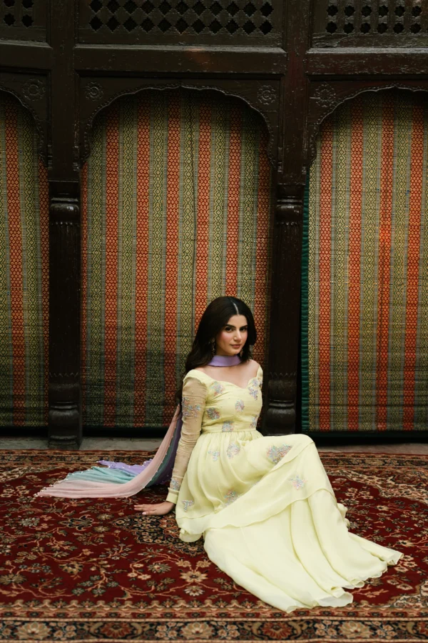 Seated look of Sunehri luxury peplum dress