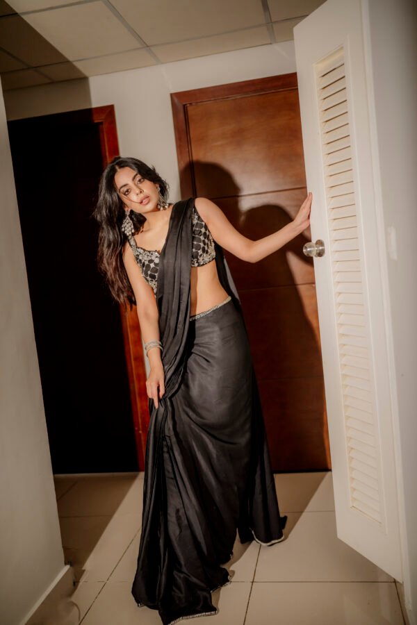 Midnight Saree featuring delicate machine embroidery and hand embellishment